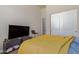 Bedroom featuring a comfortable bed and flat-screen TV at 16738 E Lone Mountain Rd, Scottsdale, AZ 85262