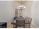 Formal dining room with wood table and chandelier at 16738 E Lone Mountain Rd, Scottsdale, AZ 85262