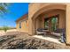 Inviting patio with seating for relaxation and desert landscaping at 16738 E Lone Mountain Rd, Scottsdale, AZ 85262
