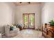 Relaxing bedroom with a comfortable seating area and patio access at 16738 E Lone Mountain Rd, Scottsdale, AZ 85262