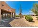 Landscaped backyard with desert plants and a large cactus at 16738 E Lone Mountain Rd, Scottsdale, AZ 85262