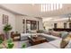 Bright living room with sectional sofa, coffee table, and access to patio at 16738 E Lone Mountain Rd, Scottsdale, AZ 85262