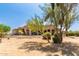 Spacious backyard with mature trees and desert landscape at 16738 E Lone Mountain Rd, Scottsdale, AZ 85262