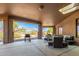 Covered patio with outdoor furniture and mountain views at 16738 E Lone Mountain Rd, Scottsdale, AZ 85262