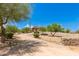 Stunning ranch-style home with a brick driveway and mature landscaping at 16738 E Lone Mountain Rd, Scottsdale, AZ 85262
