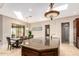 Island kitchen with granite countertop and breakfast bar seating at 16738 E Lone Mountain Rd, Scottsdale, AZ 85262