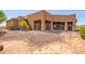 House exterior showcasing a metal staircase and gated patio at 16738 E Lone Mountain Rd, Scottsdale, AZ 85262