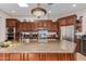 Kitchen with granite island and stainless steel appliances at 16738 E Lone Mountain Rd, Scottsdale, AZ 85262