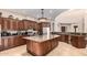 Island kitchen with granite countertops and stainless steel appliances at 16738 E Lone Mountain Rd, Scottsdale, AZ 85262