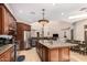 Open concept kitchen with large island, granite countertops, and stainless steel appliances at 16738 E Lone Mountain Rd, Scottsdale, AZ 85262