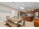 Kitchen with island, wood cabinets, and breakfast nook at 16738 E Lone Mountain Rd, Scottsdale, AZ 85262