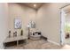 Cozy sitting area featuring a comfortable chair and artwork at 16738 E Lone Mountain Rd, Scottsdale, AZ 85262