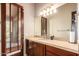 Bathroom with single sink vanity and exterior access at 16738 E Lone Mountain Rd, Scottsdale, AZ 85262