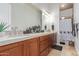 Double vanity bathroom with a shower and modern fixtures at 16738 E Lone Mountain Rd, Scottsdale, AZ 85262