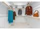 Large walk-in closet with ample shelving and hanging space at 9649 E Solina Ave, Mesa, AZ 85212