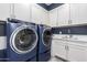 Laundry room with front-load washer and dryer at 9649 E Solina Ave, Mesa, AZ 85212
