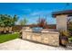 Built-in outdoor kitchen with grill and ample counter space at 9649 E Solina Ave, Mesa, AZ 85212