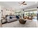 Spacious living room with access to backyard patio at 9649 E Solina Ave, Mesa, AZ 85212
