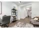 Modern home office with grey chairs and a view to the hallway at 9649 E Solina Ave, Mesa, AZ 85212