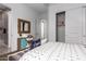 Cozy bedroom with teal dresser and ensuite bathroom at 9649 E Solina Ave, Mesa, AZ 85212