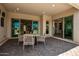 Covered patio with outdoor dining furniture at 9649 E Solina Ave, Mesa, AZ 85212