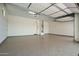 Spacious garage with epoxy flooring and extra storage at 9649 E Solina Ave, Mesa, AZ 85212