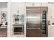 Stainless steel appliances including a built-in oven, microwave, and wine cooler at 9649 E Solina Ave, Mesa, AZ 85212