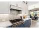 Modern kitchen with stainless steel appliances and herringbone backsplash at 9649 E Solina Ave, Mesa, AZ 85212