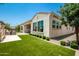 Back exterior view of the house with landscaping at 9649 E Solina Ave, Mesa, AZ 85212