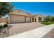 Two-story home with a two car garage and well-maintained landscaping at 9649 E Solina Ave, Mesa, AZ 85212