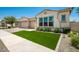 Beautiful stucco home with two-car garage and artificial turf lawn at 9649 E Solina Ave, Mesa, AZ 85212