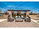 Relaxing backyard with pergola, seating, and fire pit at 9649 E Solina Ave, Mesa, AZ 85212