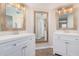 Double vanity bathroom with white cabinets and a large mirror at 9140 W Kimberly Way, Peoria, AZ 85382