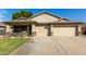 Two-car garage and front yard landscaping at 22831 N 103Rd Ln, Peoria, AZ 85383