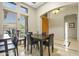 Dining area with a table and chairs, adjacent to the entryway at 6529 W Via Montoya Dr, Glendale, AZ 85310