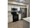 Modern kitchen with stainless steel appliances and granite countertops at 9140 W Kimberly Way, Peoria, AZ 85382