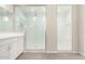 Spa-like bathroom featuring double sinks, walk-in shower, and separate shower at 23997 N 172Nd Ave, Surprise, AZ 85387