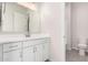 Bathroom with white vanity, toilet, and mirror at 23997 N 172Nd Ave, Surprise, AZ 85387