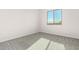 Well-lit bedroom featuring neutral wall paint and carpet at 23997 N 172Nd Ave, Surprise, AZ 85387