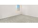 Bright bedroom with neutral carpeting and a window at 23997 N 172Nd Ave, Surprise, AZ 85387