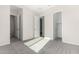 Bright bedroom with carpet flooring and access to bathroom and closet at 23997 N 172Nd Ave, Surprise, AZ 85387