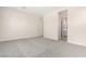 Spacious bedroom with grey carpet and ensuite bathroom access at 23997 N 172Nd Ave, Surprise, AZ 85387