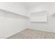 Spacious closet with built-in shelves, providing ample storage at 23997 N 172Nd Ave, Surprise, AZ 85387