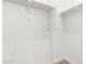 White built-in shelving in corner closet at 23997 N 172Nd Ave, Surprise, AZ 85387