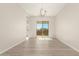 Bright dining room with hardwood floors and sliding glass door leading to patio at 23997 N 172Nd Ave, Surprise, AZ 85387