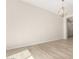 Spacious dining room featuring hardwood floors and modern light fixture at 23997 N 172Nd Ave, Surprise, AZ 85387