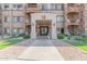 Main entrance of a residential building with landscaping and walkway at 5350 E Deer Valley Dr # 4271, Phoenix, AZ 85054
