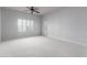 Spacious bedroom with neutral walls, carpet, and sliding door to balcony at 5350 E Deer Valley Dr # 4271, Phoenix, AZ 85054