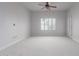 Bright bedroom featuring carpeted floors, plantation shutters and ceiling fan at 5350 E Deer Valley Dr # 4271, Phoenix, AZ 85054