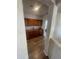 Hallway with wood floors and built-in wooden cabinets at 7264 W Cielo Grande --, Peoria, AZ 85383